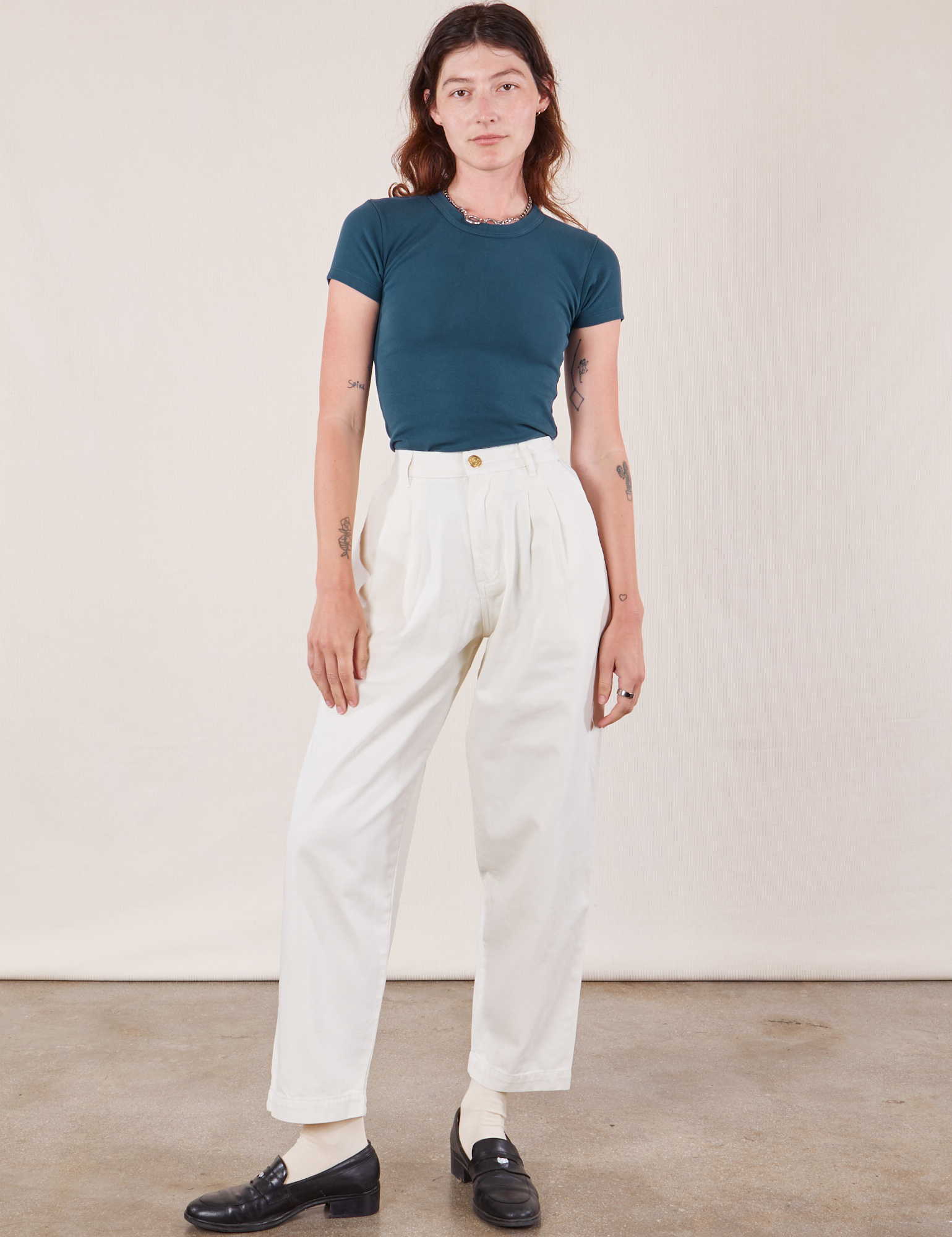 Alex is wearing Baby Tee in Lagoon and vintage tee off-white Heavyweight Trousers