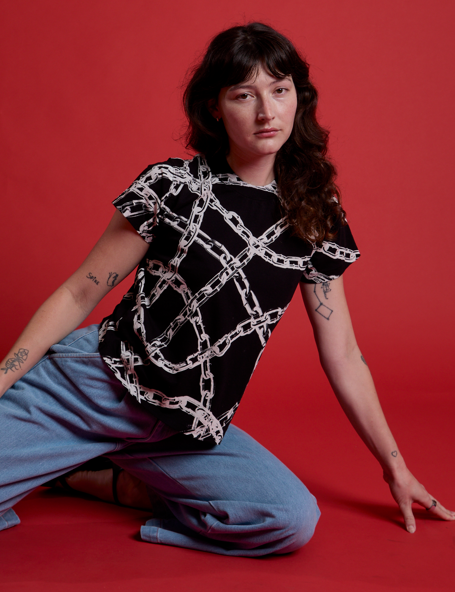 Alex has on the Chain Link Vintage Tee in Basic Black