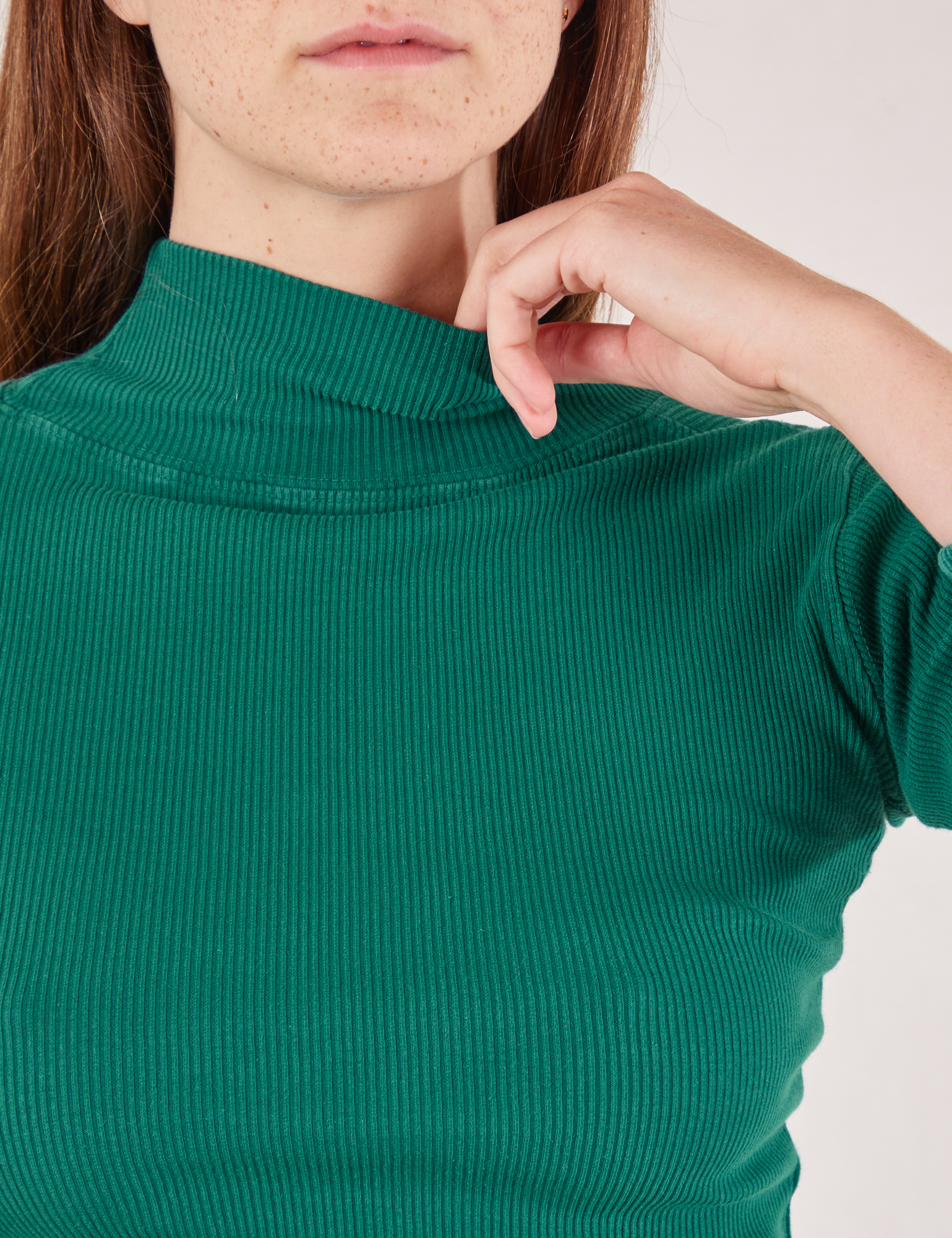 Essential Turtleneck in Hunter Green front close up on Scarlett