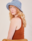 Margaret is wearing Wide Brim Denim Bucket Hat in light wash