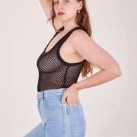 Side view of Mesh Tank Top in Basic Black and light wash Sailor Jeans worn by Allison