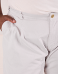 Mid-Rise Pleated Trousers in Stone White front close up on Elijah