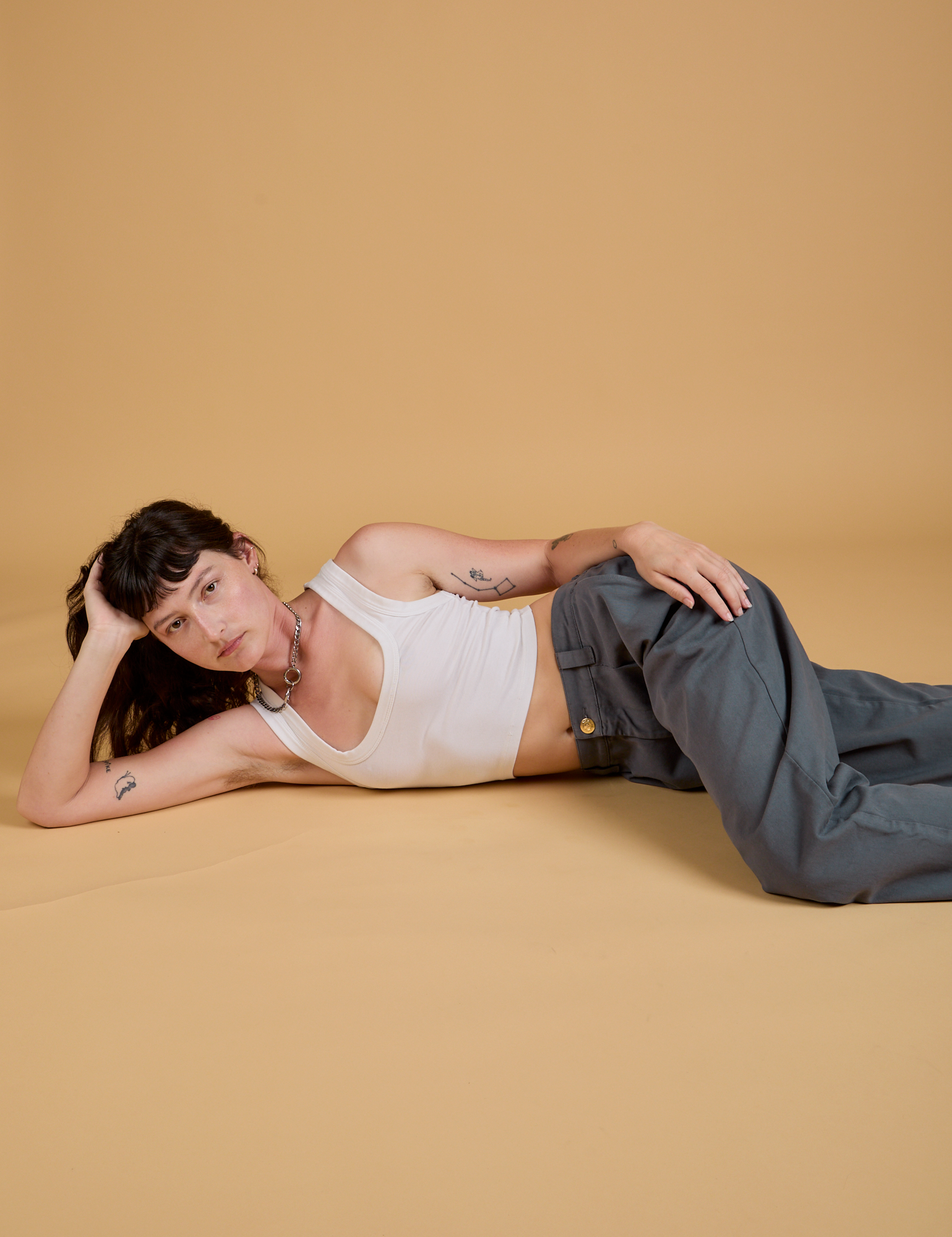 Baggy Mid-Rise Trousers in Slate Grey and Cropped Tank in Vintage Tee White worn by Alex