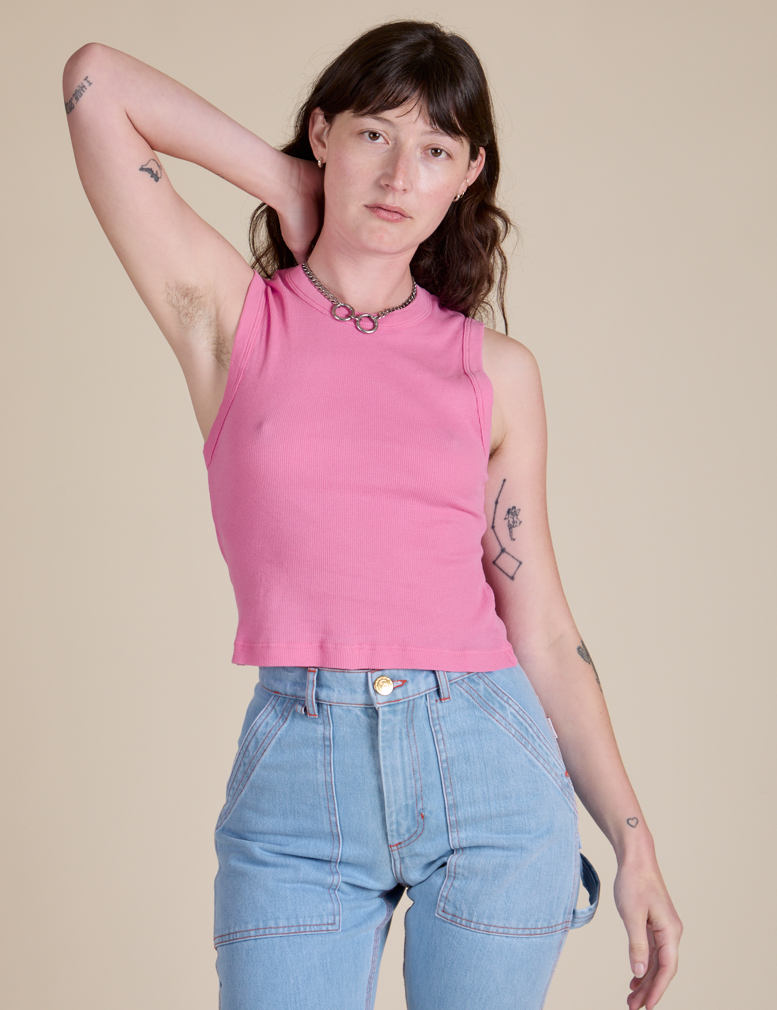 Alex is wearing Muscle Tee in Bubblegum Pink