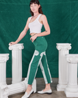 Side view of Column Work Pants in Hunter Green and vintage off-white Cropped Tank Top on Alex