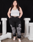 Ashley is 5'7" and wearing 1XL Black Venus Work Pants paired with vintage off-white Cropped Tank Top