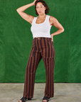 Tiara is wearing Black Stripe Work Pants in Fudgesicle Brown and Cropped Tank in vintage tee off-white