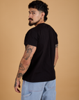 Angled back view of Organic Vintage Tee in Basic Black on Jesse