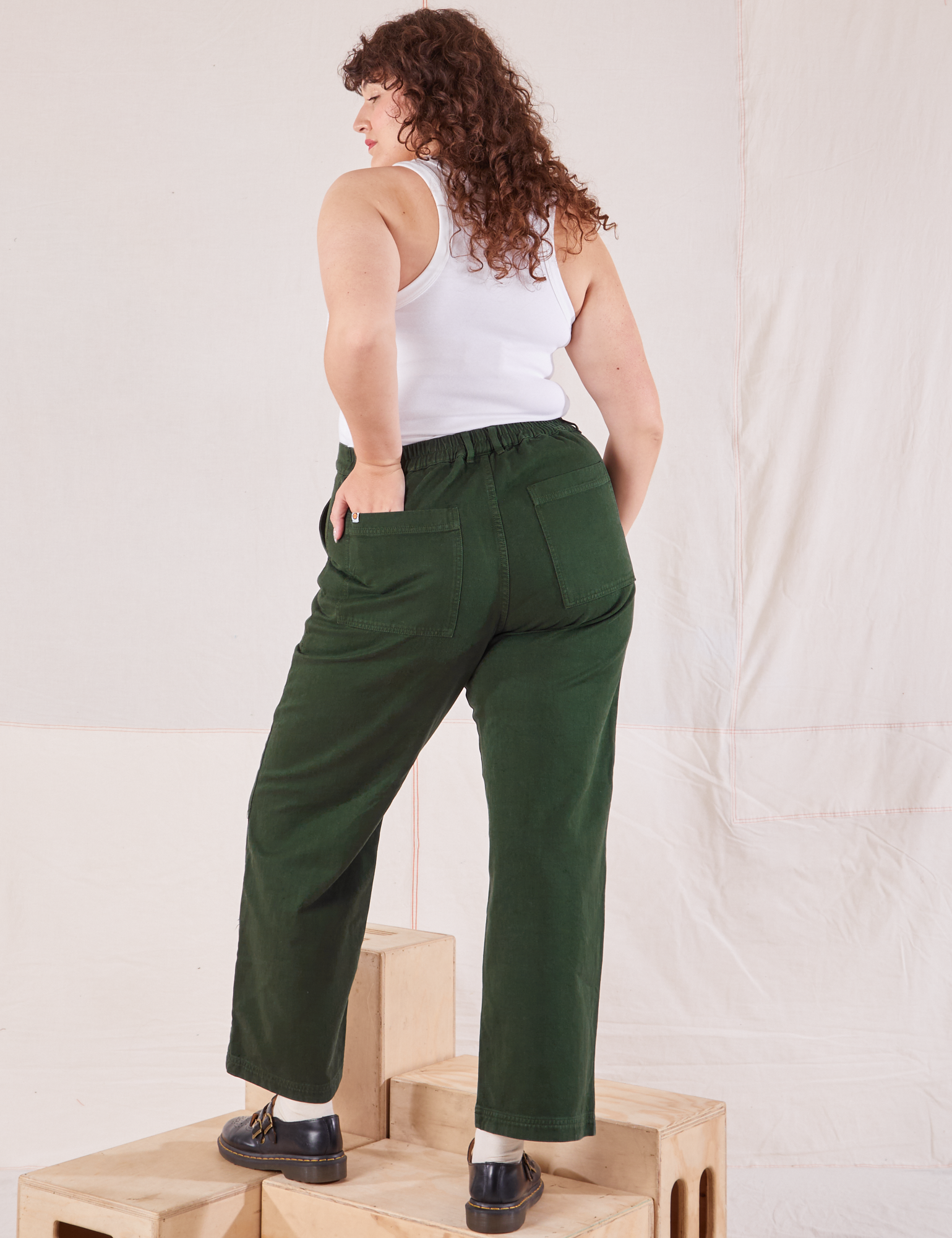 Organic Work Pants in Swamp Green back view on Ryan