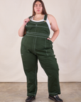 Marielena is 5'8" and wearing 2XL Original Overalls in Swamp Green