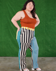 Angled front view of Mismatched Stripe Work Pants and burnt terracotta Cropped Tank Top