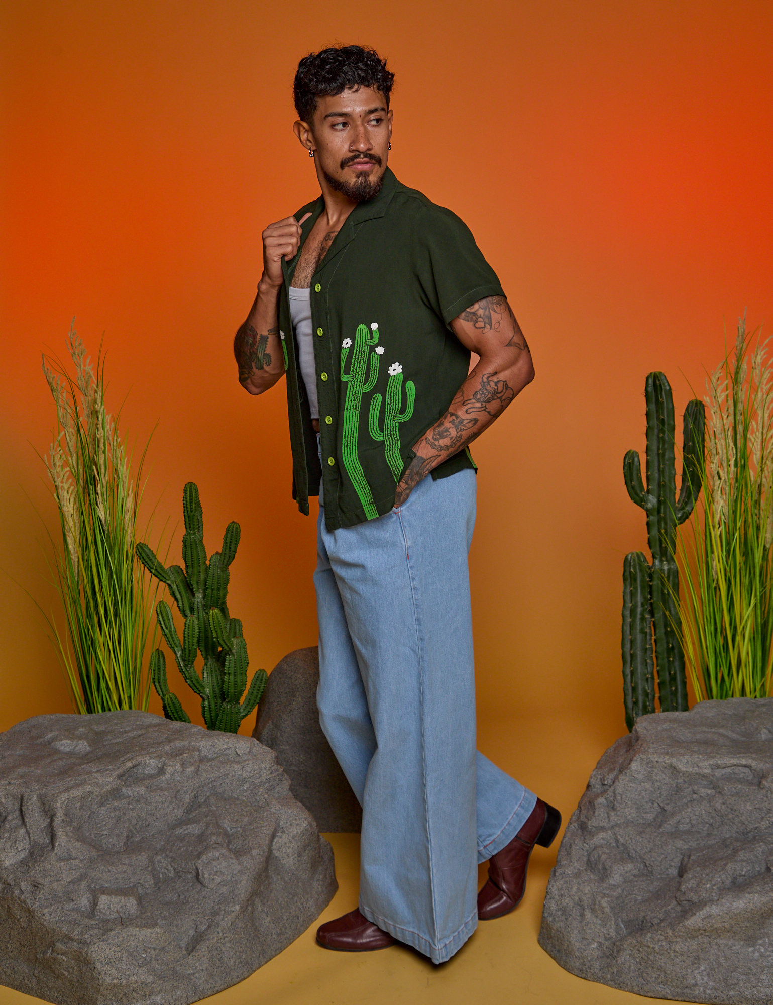 Side view of Paintstamped Pantry Button-Up in Cactus and light wash Indigo Wide Leg Trouser on Jesse