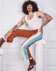 Jesse is wearing Hand-Painted Stripe Western Pants in Burnt Terracotta and a vintage off-white Tank Top
