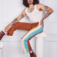 Jesse is wearing Hand-Painted Stripe Western Pants in Burnt Terracotta and a vintage off-white Tank Top