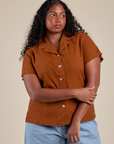 Meghna is 5’8” and wearing M Pantry Button-Up in Burnt Terracotta