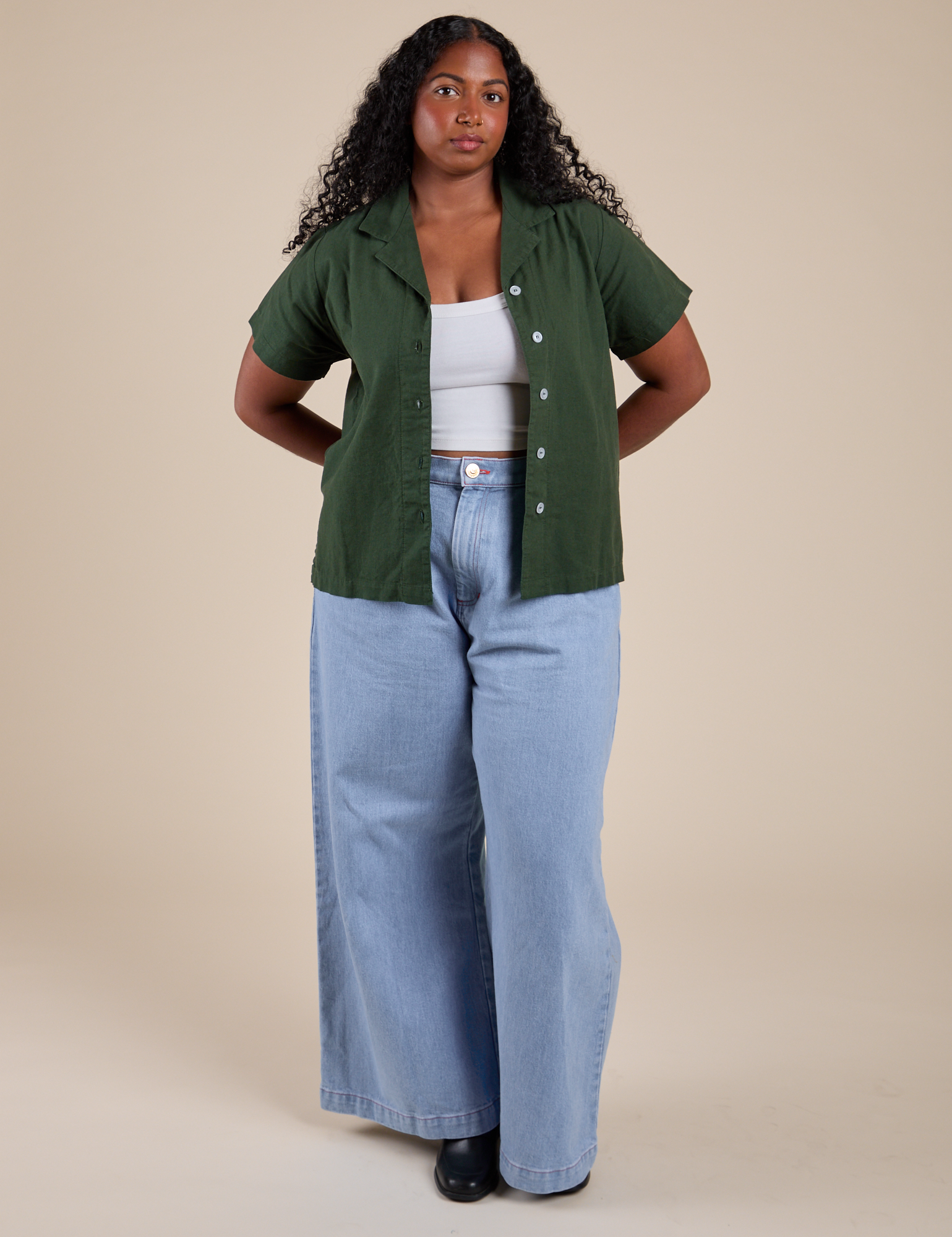 Pantry Button-Up in Swamp Green and light wash Indigo Wide Leg Trousers on Meghna