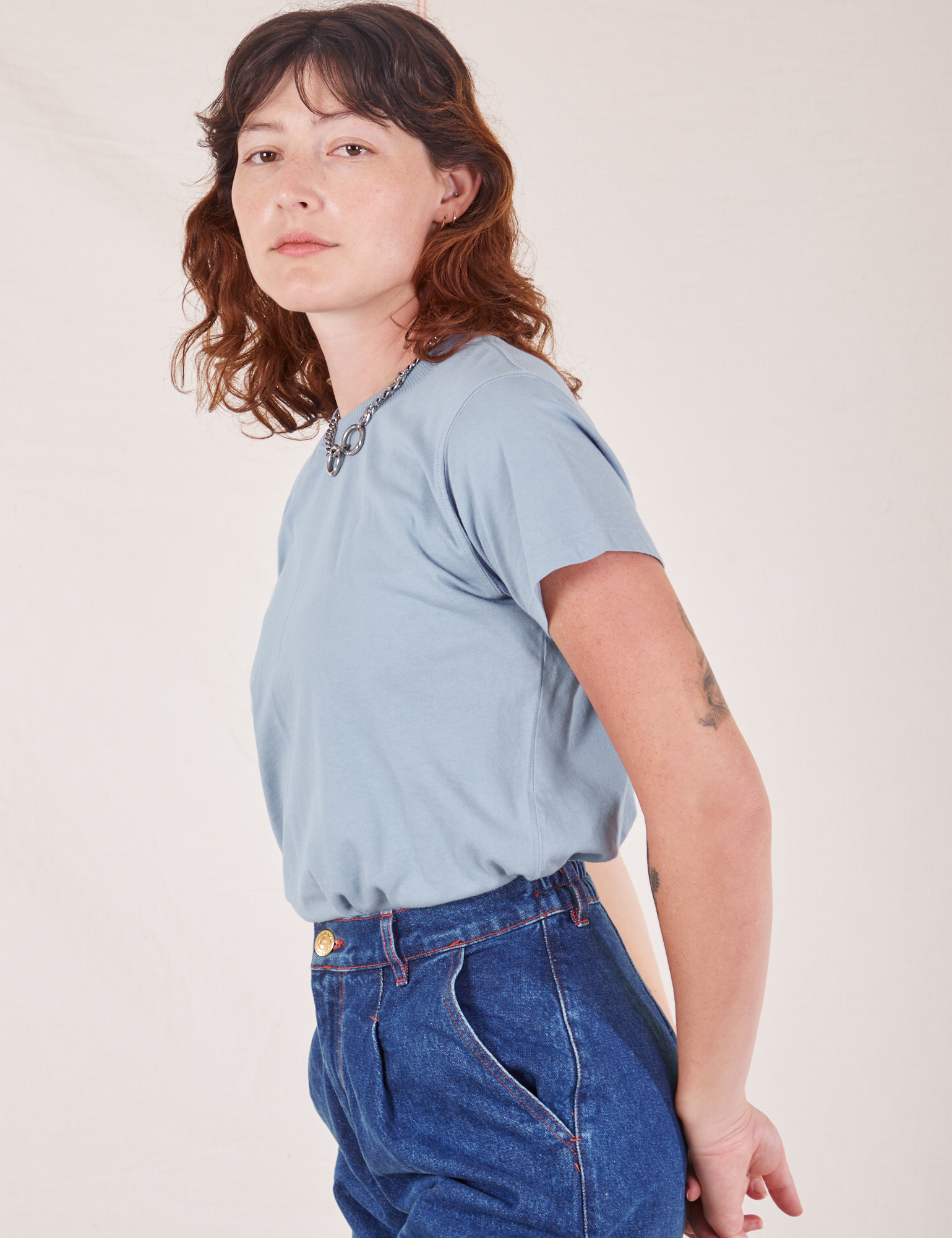 Side view of The Organic Vintage Tee in Periwinkle on Alex