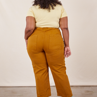 Work Pants in Spicy Mustard back view on Morgan wearing butter yellow Baby Tee
