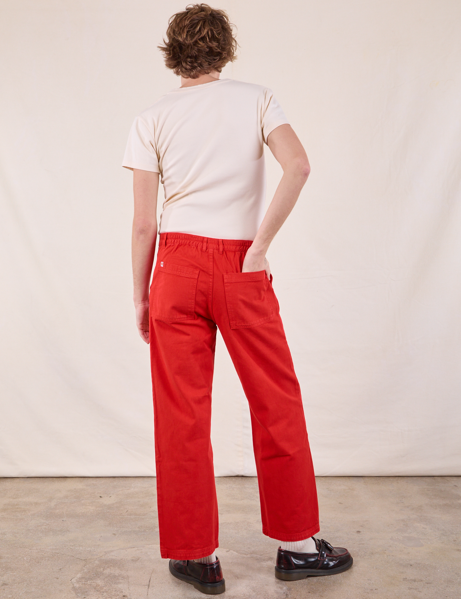 Back view of Work Pants in Mustang Red and Burly Tee in Vintage Tee Off-White