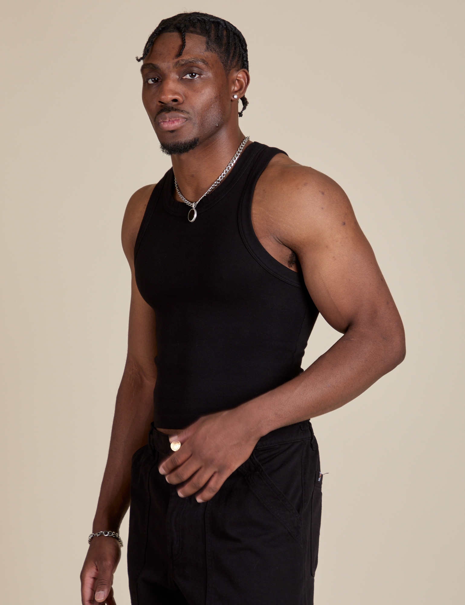 Racerback Tank in Black angled front view on Isaac