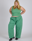 Juliet is 5’7” and wearing 2XL Drop Pocket Cargo Pants in Seafoam Green paired with matching Muscle Tee