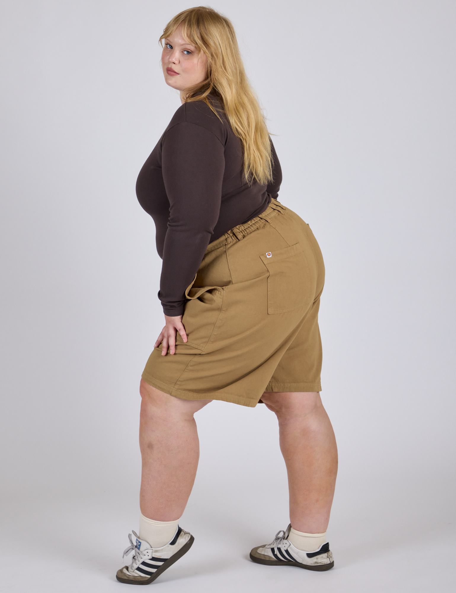 Side view of Longline Work Shorts in Desert Brown and espresso brown Long Sleeve Baby Tee on Juliet