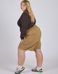 Side view of Longline Work Shorts in Desert Brown and espresso brown Long Sleeve Baby Tee on Juliet