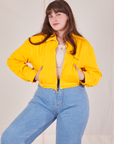 Ricky Jacket in Sunshine Yellow worn by Sydney with her hands in both pockets