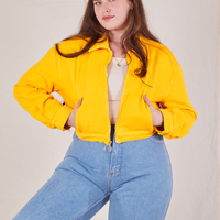 Ricky Jacket in Sunshine Yellow worn by Sydney with her hands in both pockets