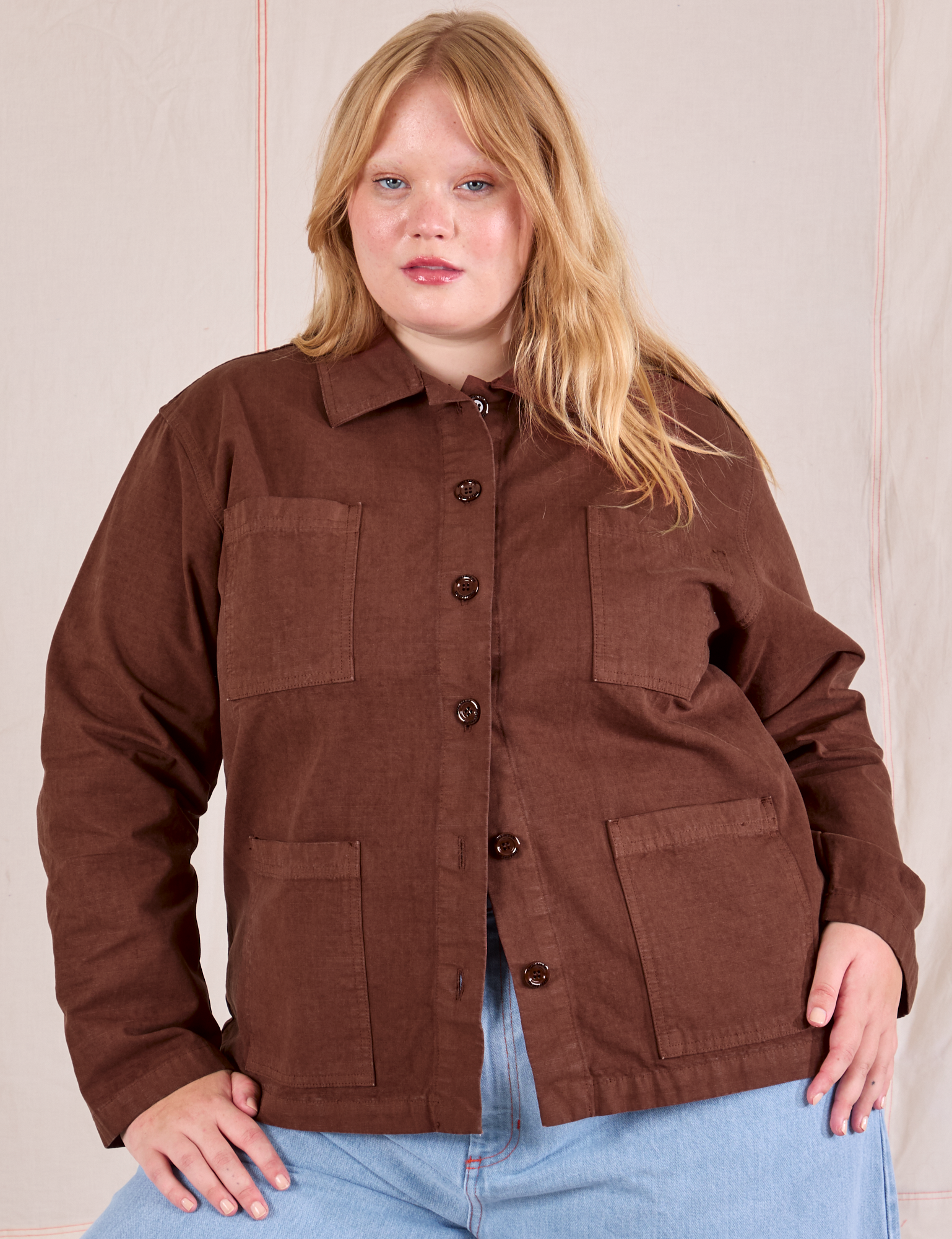 Juliet is wearing a buttoned up Ripstop Work Jacket in Fudgesicle Brown