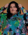 Oversized Hoodie in Rainbow Magic Waters front close up on Sam with hood on