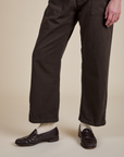 Short Sleeve Jumpsuit in Espresso Brown pant leg close up on Quinn