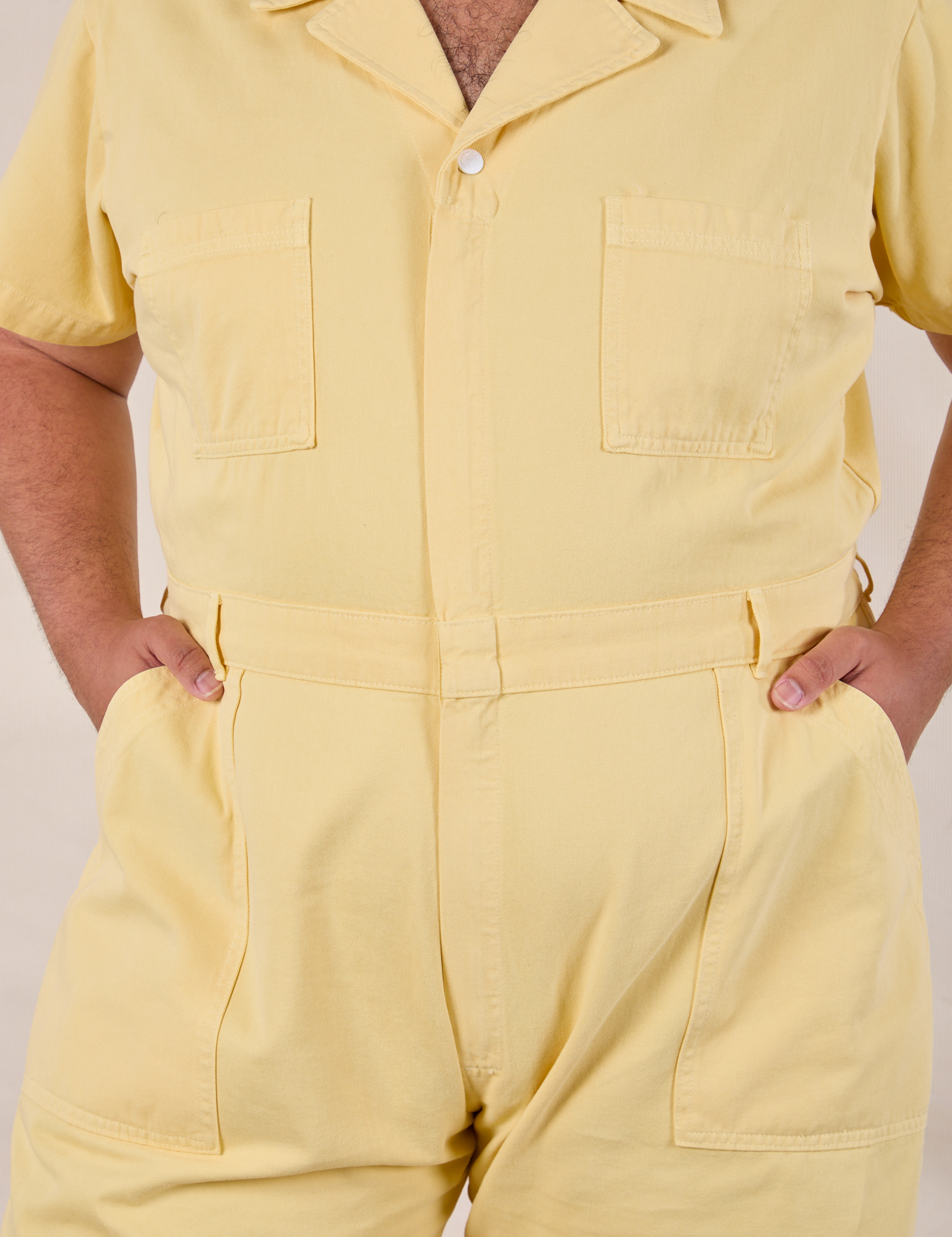 Short Sleeve Jumpsuit in Butter Yellow front close up on Miguel