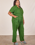 Side view of Short Sleeve Jumpsuit in Lawn Green worn by Alicia