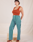 Angled view of Stripe Work Pants in Green and burnt terracotta Cropped Tank