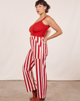 Side view of Work Pants in Cherry Stripe and mustang red Cropped Cami on Tiara