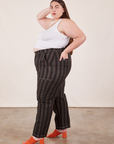 Side view of Black Striped Work Pants in Espresso and vintage off-white Cropped Tank Top on Marielena