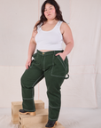 Ashley is wearing Carpenter Jeans in Swamp Green and Cropped Tank in Vintage Tee Off-White