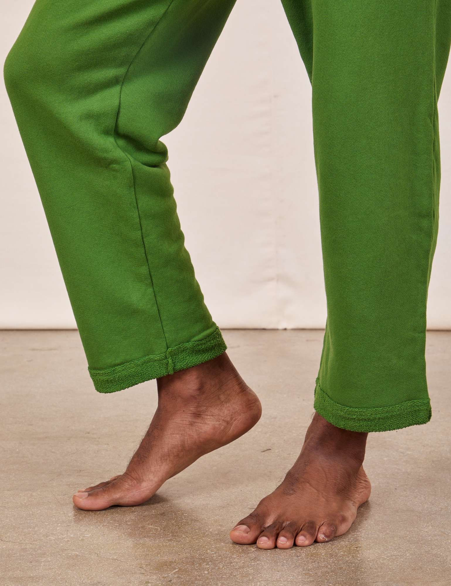 Cropped Rolled Cuff Sweatpants in Lawn Green pant leg side view close up on Jerrod