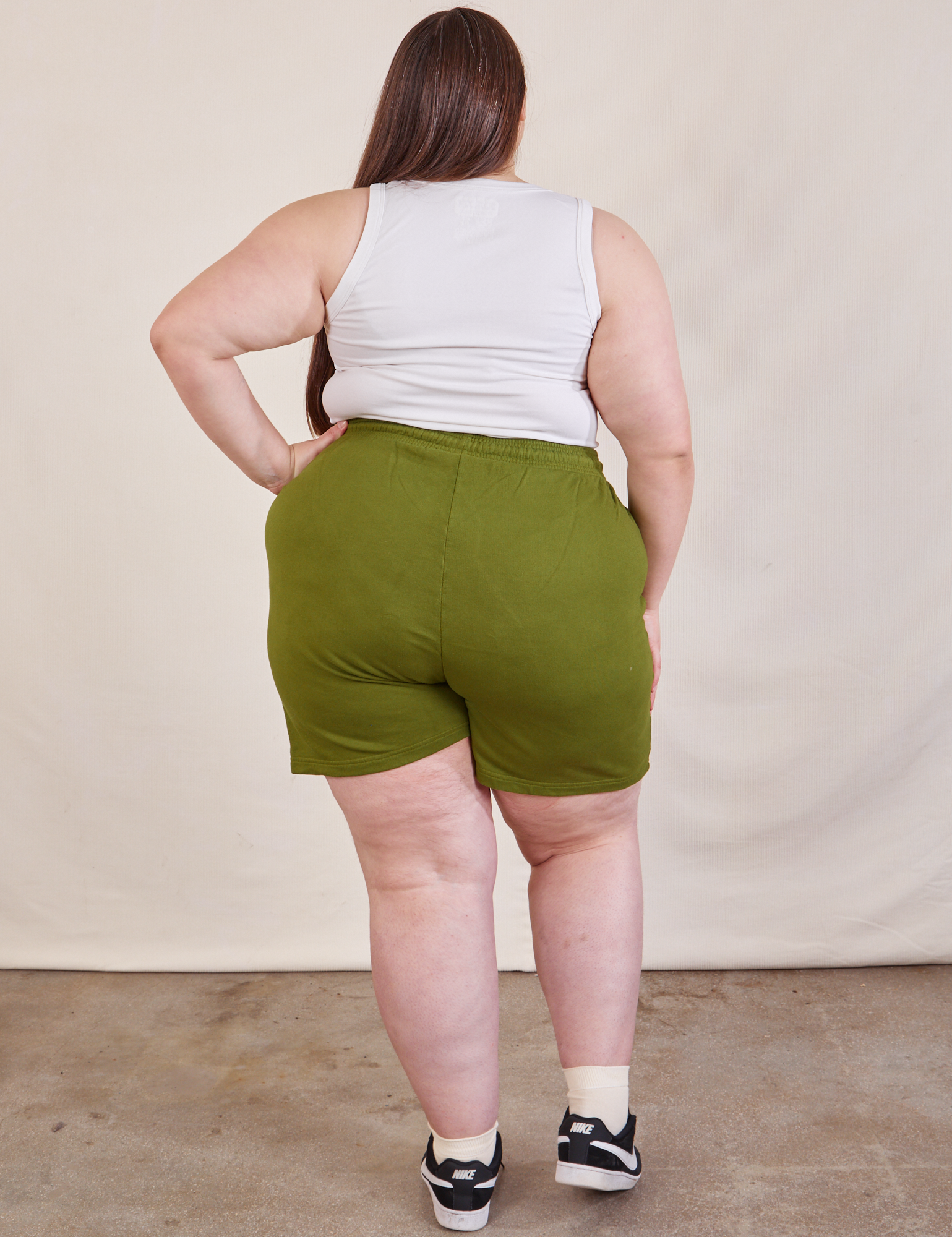 Back view of Lightweight Sweat Shorts in Summer Olive and Cropped Tank in vintage tee off-white on Marielena