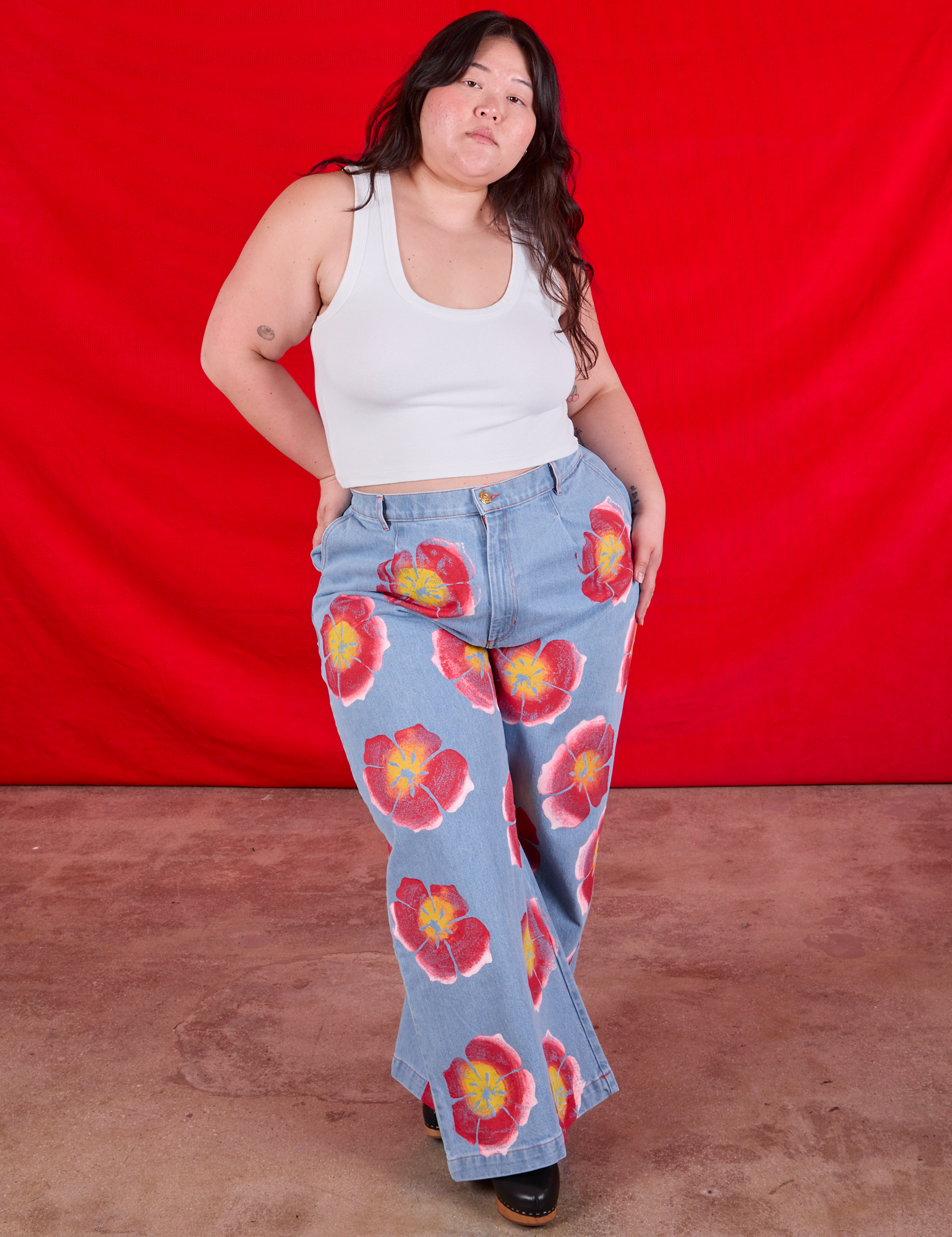 Wide Leg Denim Trousers in Painted Flowers and Cropped Tank in Vintage Tee Off-White worn by Ashley