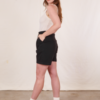 Side view of Trouser Shorts in Basic Black and vintage off-white Tank Top worn by Allison