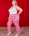 Side view of Paintstamped Heart Work Pants in Bubblegum Pink and Cropped Tank in Vintage Tee Off-White on Juliet