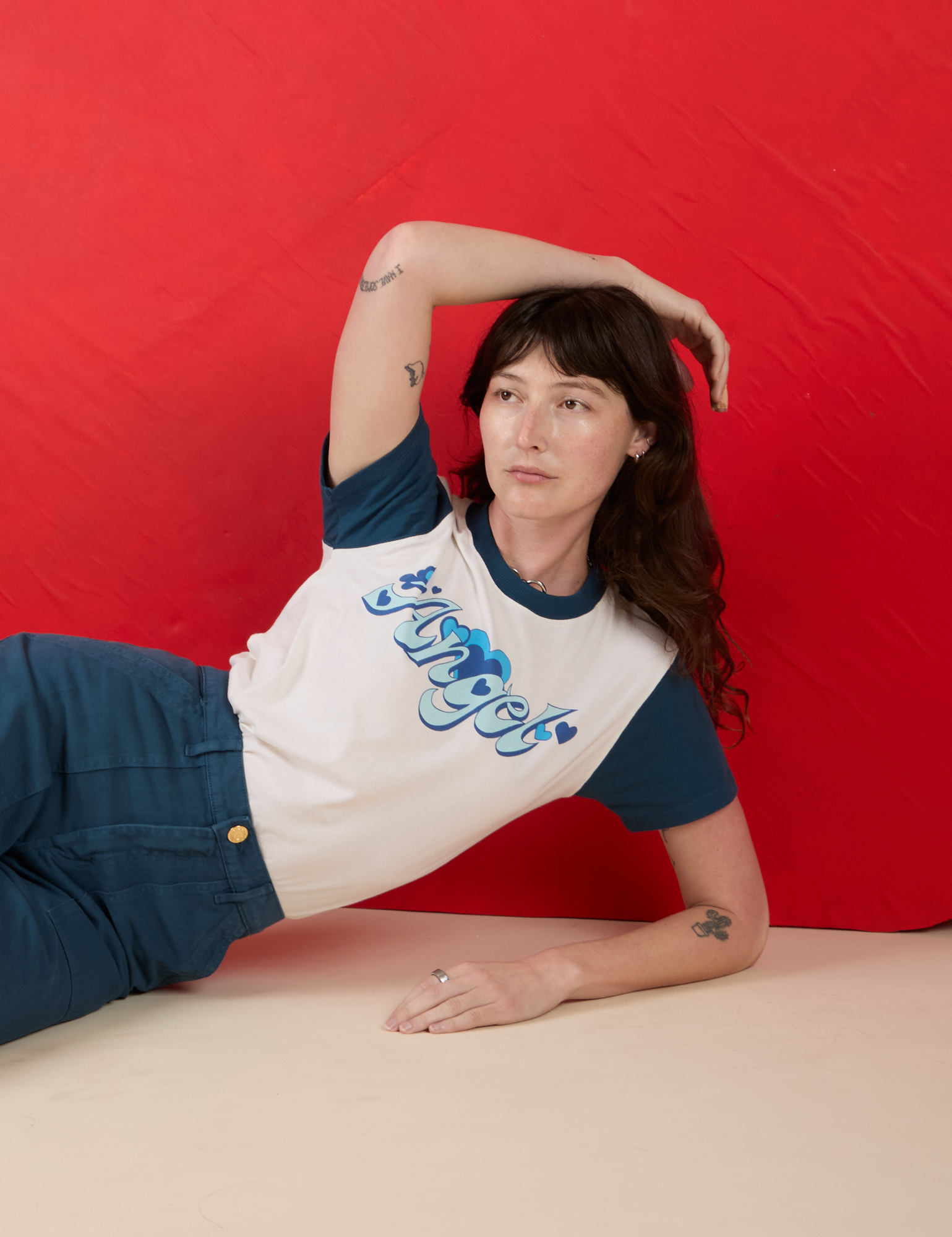 Alex is wearing Vintage Tee in Angel