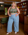 Juliet is wearing Cropped Tank Top in Kitchen Collection and light wash Indigo Wide Leg Trousers