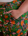 Close up of Juliet's hand in the front pocket of Work Pants in Kitchen Collection