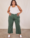 Alicia is 5'9" and wearing 2XL Western Pants in Dark Green Emerald paired with a vintage off-white Tank Top