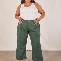 Alicia is 5'9" and wearing 2XL Western Pants in Dark Green Emerald paired with a vintage off-white Tank Top