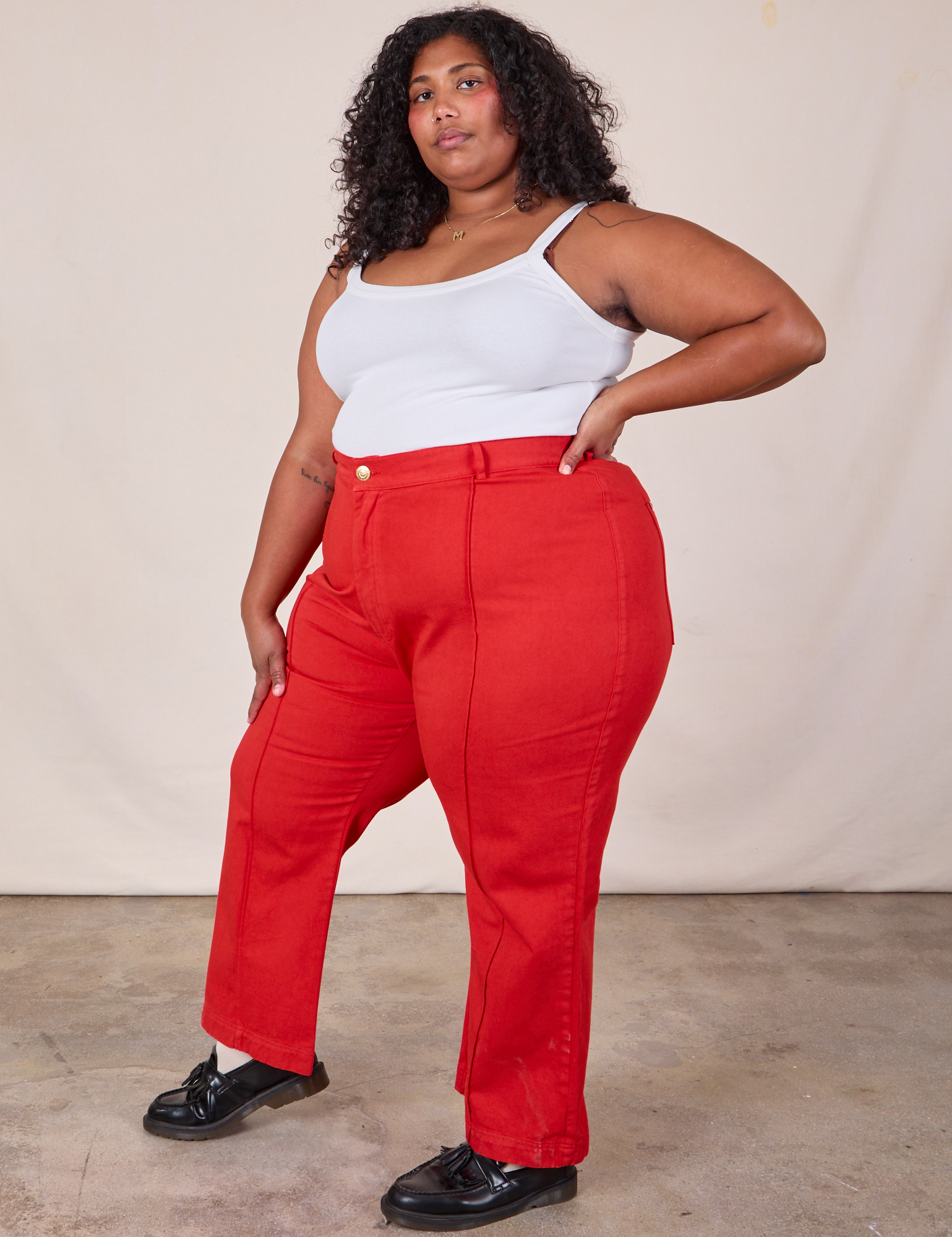 Side view of Western Pants in Mustang Red and Cropped Cami in Vintage Tee Off-White on Morgan