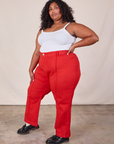 Side view of Western Pants in Mustang Red and Cropped Cami in Vintage Tee Off-White on Morgan